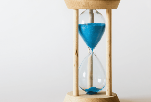 Sand running through an hourglass, symbolizing limited time
