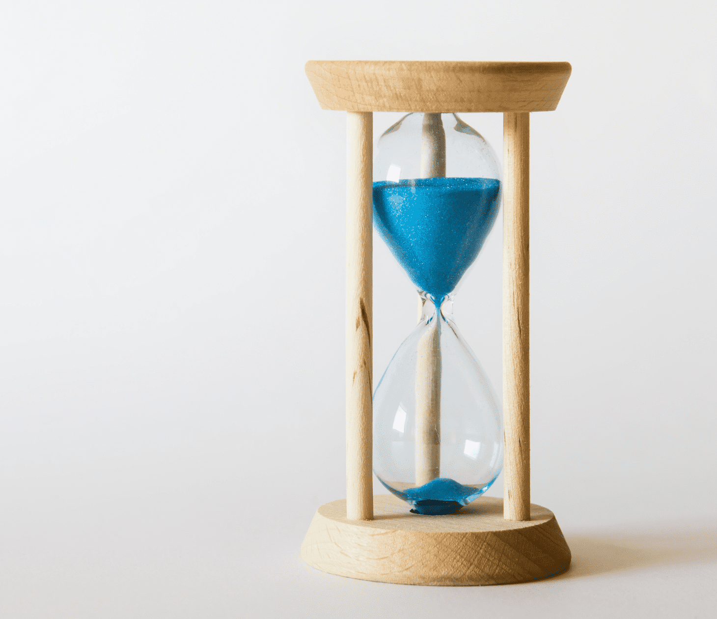Sand running through an hourglass, symbolizing limited time